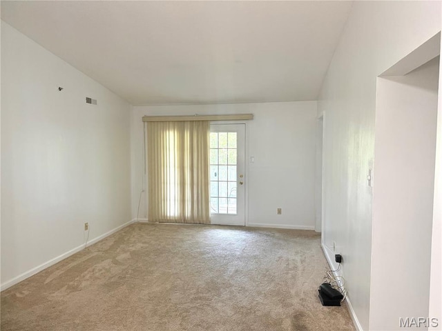 905 Hanna Place Ct Unit C, Manchester, MO 63021 - spare room with light colored carpet, baseboards, and vaulted ceiling