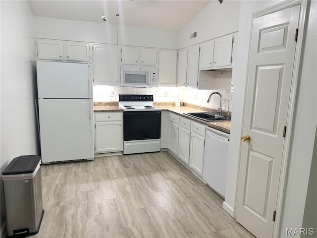 905 Hanna Place Ct Unit C, Manchester, MO 63021 - kitchen featuring white appliances, a sink, white cabinetry, and decorative backsplash