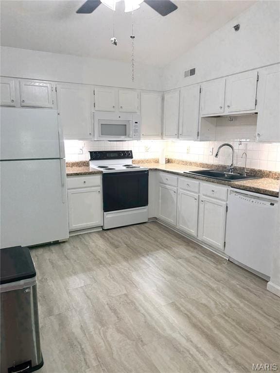 905 Hanna Place Ct Unit C, Manchester, MO 63021 - kitchen featuring white appliances, a sink, white cabinetry, and vaulted ceiling