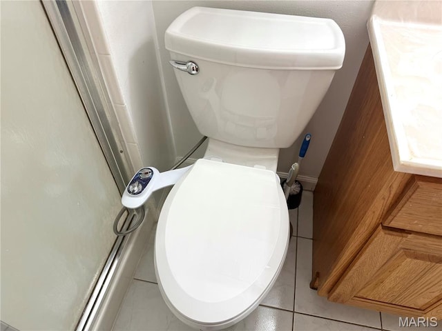 905 Hanna Place Ct Unit C, Manchester, MO 63021 - bathroom featuring toilet, tile patterned flooring, and a shower with shower door