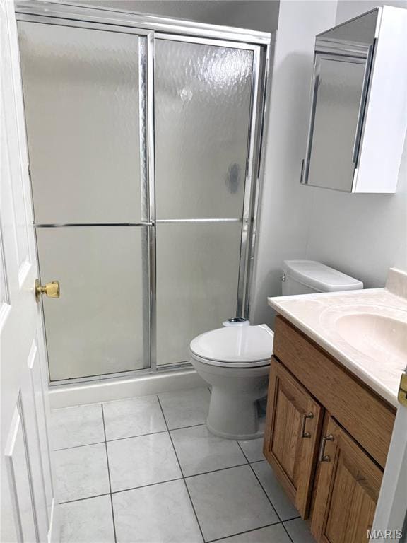 905 Hanna Place Ct Unit C, Manchester, MO 63021 - bathroom featuring vanity, a shower stall, toilet, and tile patterned flooring