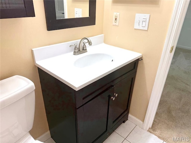 905 Hanna Place Ct Unit C, Manchester, MO 63021 - half bathroom featuring vanity, toilet, and tile patterned flooring