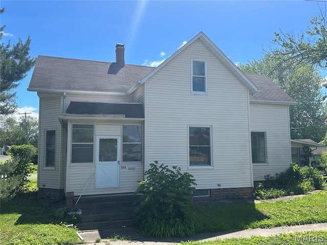 126 N Union St, Staunton, IL 62088 - rear view of house with a chimney