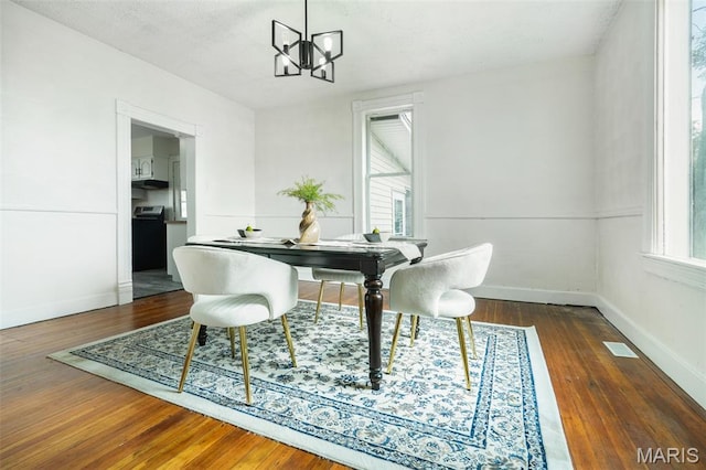 126 N Union St, Staunton, IL 62088 - dining space with a chandelier, wood-type flooring, and an office area