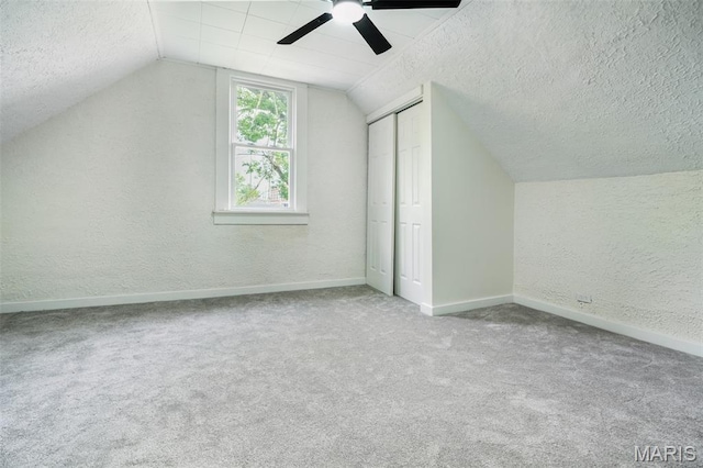 126 N Union St, Staunton, IL 62088 - additional living space featuring a textured ceiling, a textured wall, lofted ceiling, carpet flooring, and a ceiling fan