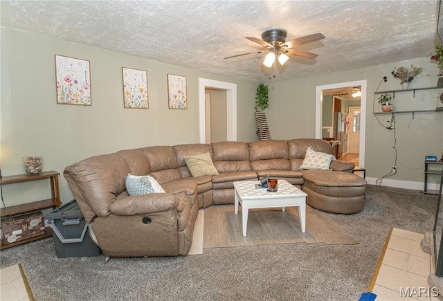 870 Walnut St, Newburg, MO 65550 - carpeted living area with ceiling fan, a textured ceiling, and baseboards