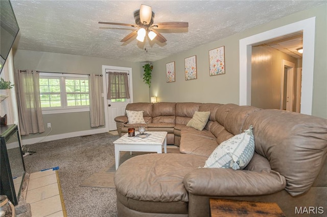 870 Walnut St, Newburg, MO 65550 - living room featuring a textured ceiling, ceiling fan, carpet floors, and baseboards