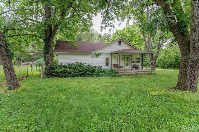 870 Walnut St, Newburg, MO 65550 - view of front facade featuring a front lawn, a shingled roof, and a porch