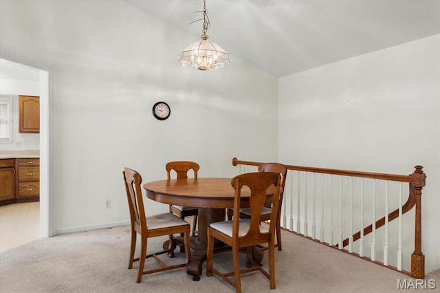 1500 Birch Ct, Edwardsville, IL 62025 - dining area featuring light colored carpet, a chandelier, and baseboards