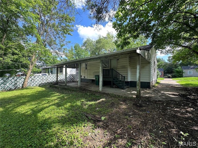 425 Crawford Rd, Riverview, MO 63137 - rear view of property featuring a patio area and a carport