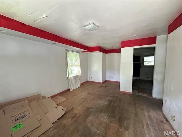 425 Crawford Rd, Riverview, MO 63137 - empty room with wood finished floors, plenty of natural light, and baseboards