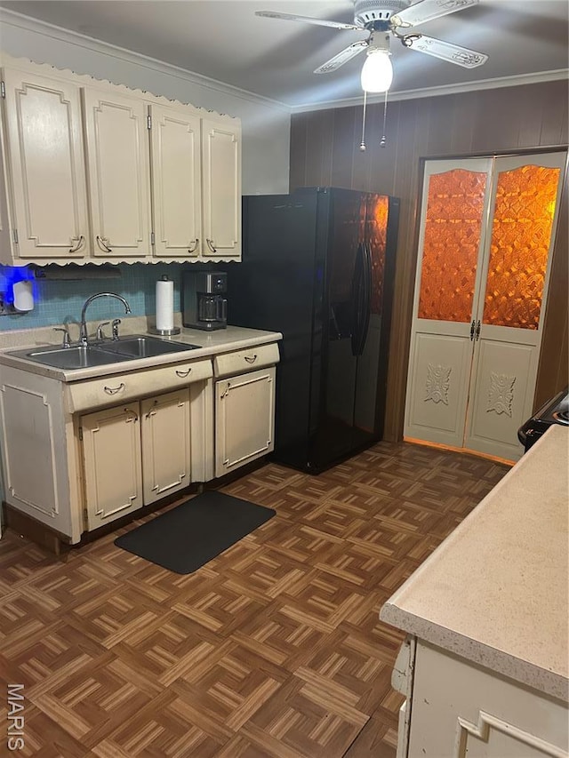 1548 Bayonne Dr, Saint Louis, MO 63138 - kitchen featuring a sink, freestanding refrigerator, ceiling fan, light countertops, and white cabinetry