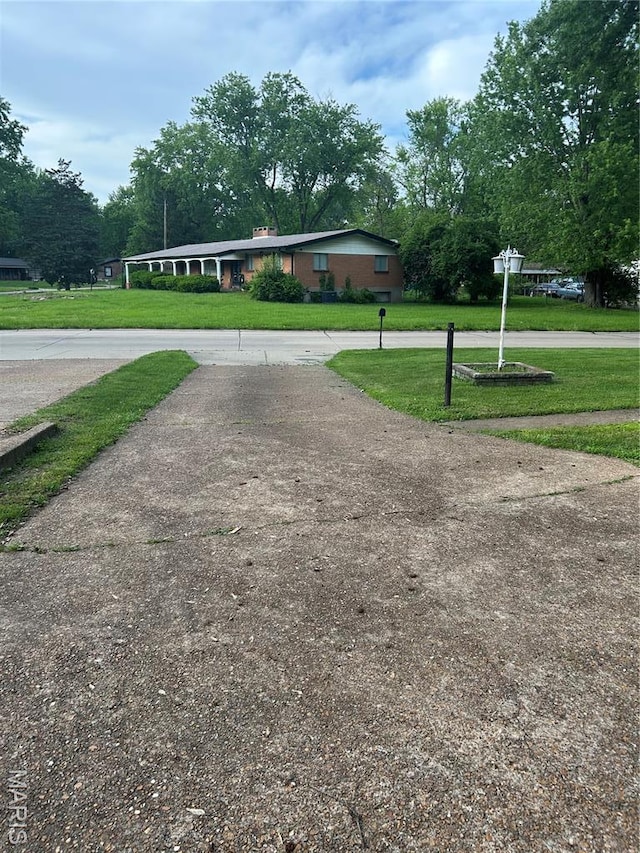 1548 Bayonne Dr, Saint Louis, MO 63138 - view of property's community featuring a lawn and view of scattered trees