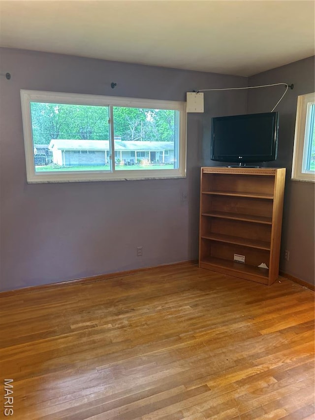 1548 Bayonne Dr, Saint Louis, MO 63138 - unfurnished bedroom with multiple windows and light wood-type flooring