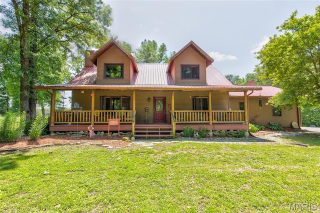 31511 Bowman Station Rd, Jerseyville, IL 62052 - farmhouse-style home with a front yard, metal roof, and a porch