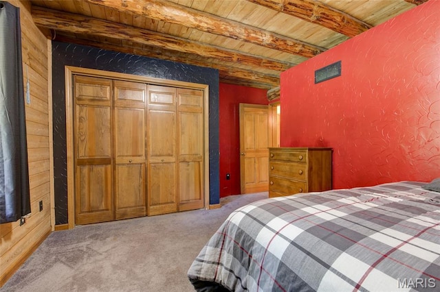 31511 Bowman Station Rd, Jerseyville, IL 62052 - bedroom featuring wood ceiling with exposed beams, carpet flooring, and a textured wall