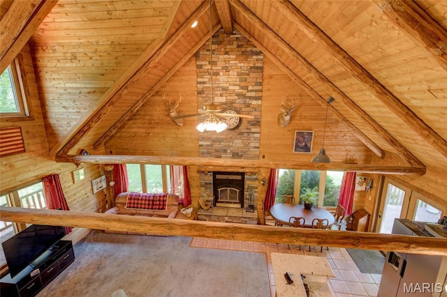31511 Bowman Station Rd, Jerseyville, IL 62052 - unfurnished living room with wood ceiling, wood walls, a stone fireplace, and ceiling fan