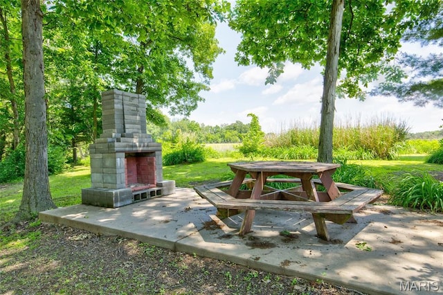 31511 Bowman Station Rd, Jerseyville, IL 62052 - view of grassy yard featuring an outdoor fireplace and a patio