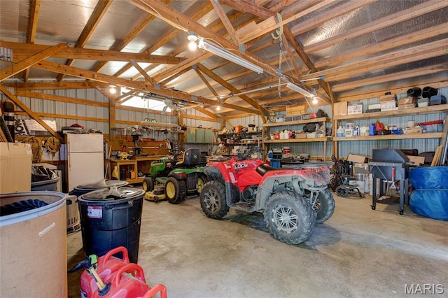 31511 Bowman Station Rd, Jerseyville, IL 62052 - garage with freestanding refrigerator and a workshop area