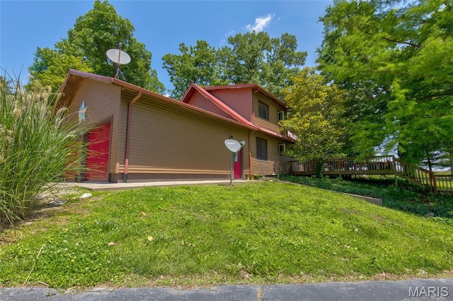31511 Bowman Station Rd, Jerseyville, IL 62052 - view of side of home with a wooden deck, a yard, and an attached garage