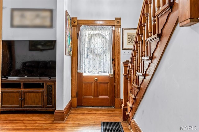 805 W Columbia St, Farmington, MO 63640 - entryway with stairway, wood finished floors, and baseboards