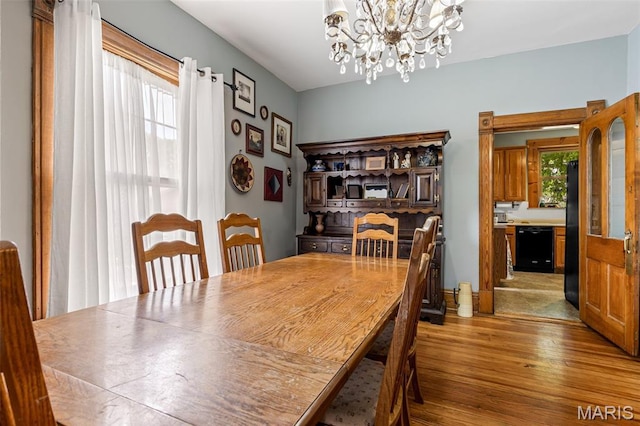 805 W Columbia St, Farmington, MO 63640 - dining space with wood finished floors and a chandelier