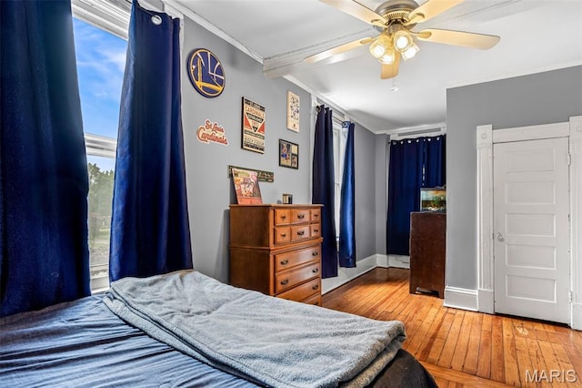 805 W Columbia St, Farmington, MO 63640 - bedroom with ornamental molding, wood-type flooring, multiple windows, baseboards, and a ceiling fan