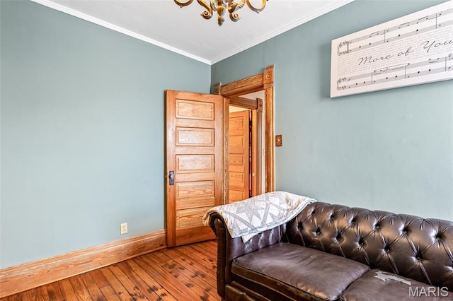 805 W Columbia St, Farmington, MO 63640 - sitting room featuring a chandelier, hardwood / wood-style floors, crown molding, and baseboards