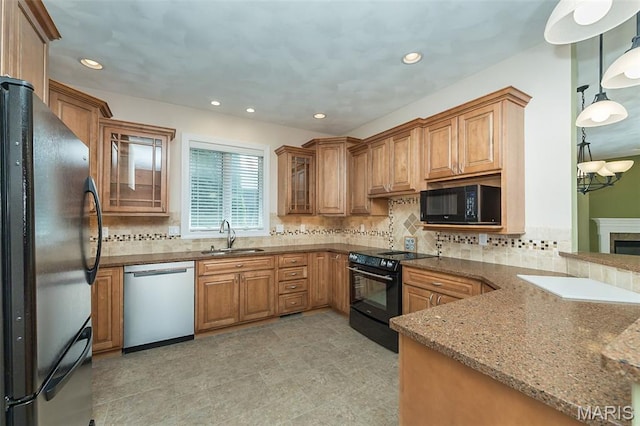 1812 Carrington Way, Belleville, IL 62226 - kitchen with black appliances, a sink, brown cabinets, dark stone countertops, and decorative backsplash