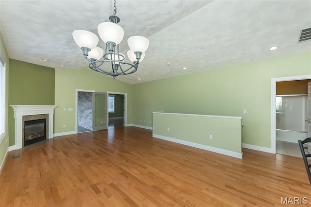 1812 Carrington Way, Belleville, IL 62226 - unfurnished living room featuring a chandelier, light wood-style floors, baseboards, a high end fireplace, and recessed lighting