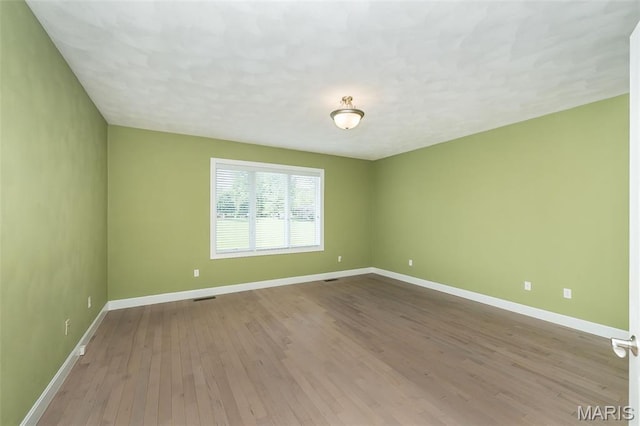 1812 Carrington Way, Belleville, IL 62226 - spare room with baseboards and wood finished floors