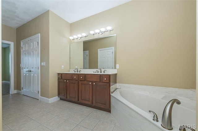 1812 Carrington Way, Belleville, IL 62226 - bathroom featuring tile patterned flooring, double vanity, a bath, and baseboards