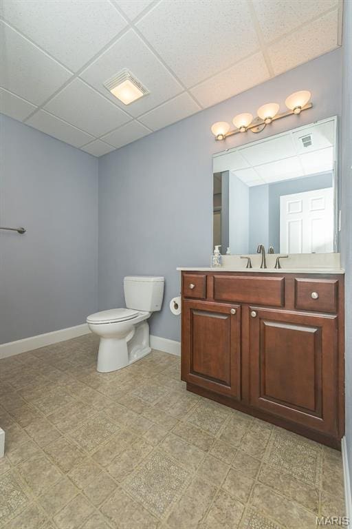 1812 Carrington Way, Belleville, IL 62226 - bathroom featuring a drop ceiling, toilet, vanity, and baseboards