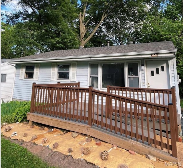 168 Elbring Dr, Hazelwood, MO 63135 - ranch-style home with a deck and a shingled roof