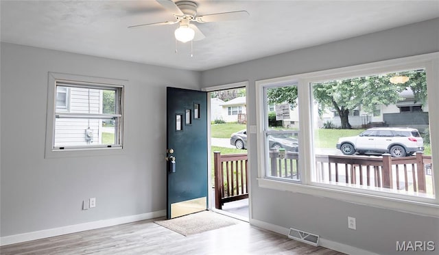 168 Elbring Dr, Hazelwood, MO 63135 - foyer entrance featuring wood finished floors, baseboards, and a ceiling fan