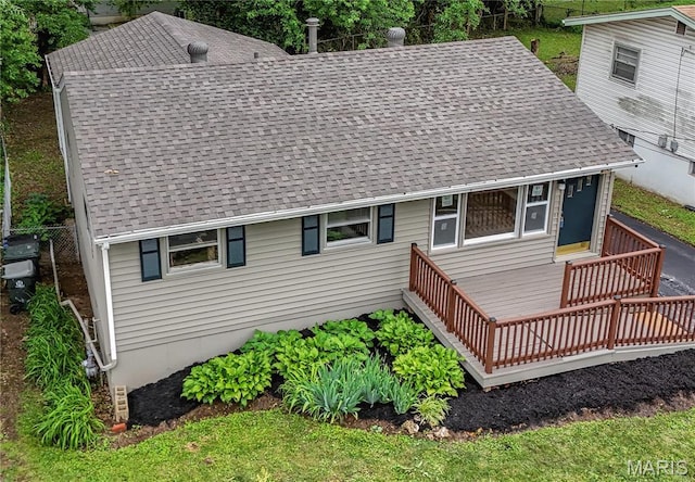 168 Elbring Dr, Hazelwood, MO 63135 - rear view of house featuring roof with shingles and a wooden deck