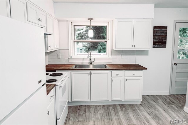 168 Elbring Dr, Hazelwood, MO 63135 - kitchen with white appliances, a sink, white cabinets, butcher block counters, and backsplash
