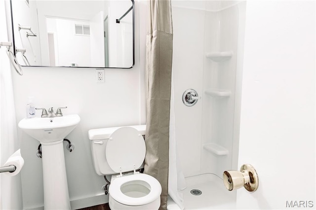 168 Elbring Dr, Hazelwood, MO 63135 - bathroom featuring toilet and a shower stall
