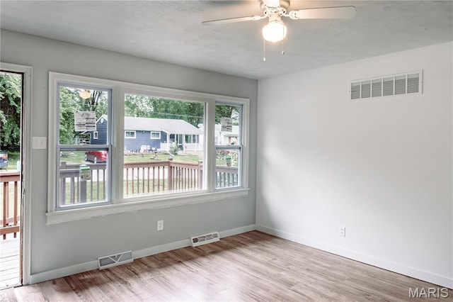 168 Elbring Dr, Hazelwood, MO 63135 - spare room with light wood finished floors, baseboards, and a ceiling fan
