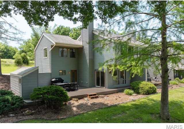 96 Geneva View Dr, Innsbrook, MO 63390 - back of property featuring a chimney, a wooden deck, and a yard