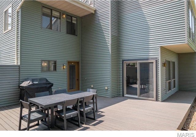 96 Geneva View Dr, Innsbrook, MO 63390 - wooden terrace with outdoor dining area and a grill