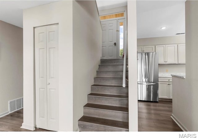 96 Geneva View Dr, Innsbrook, MO 63390 - staircase with wood finished floors, baseboards, and recessed lighting