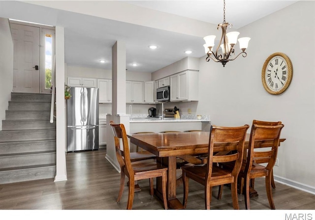 96 Geneva View Dr, Innsbrook, MO 63390 - dining area with dark wood-type flooring, a chandelier, stairs, baseboards, and recessed lighting