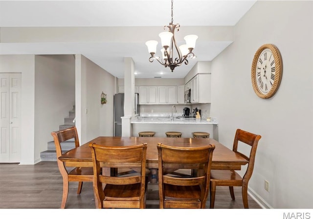 96 Geneva View Dr, Innsbrook, MO 63390 - dining room featuring wood finished floors, stairs, a chandelier, and baseboards