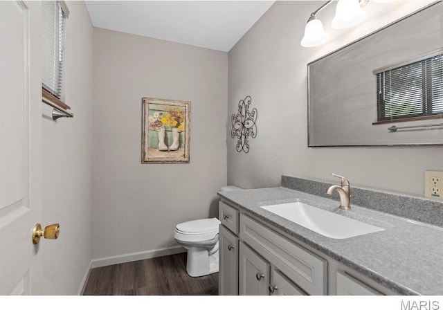 96 Geneva View Dr, Innsbrook, MO 63390 - half bath featuring wood finished floors, toilet, vanity, and baseboards