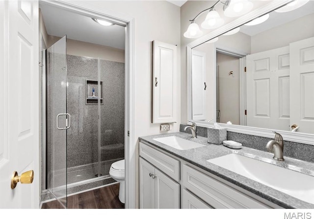 96 Geneva View Dr, Innsbrook, MO 63390 - full bathroom featuring toilet, double vanity, a stall shower, and wood finished floors