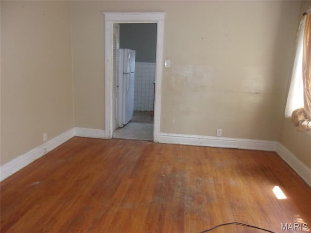 7622 Springdale Dr, Pasadena Park, MO 63121 - unfurnished room featuring wood finished floors and baseboards