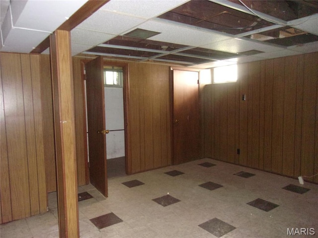 7622 Springdale Dr, Pasadena Park, MO 63121 - basement featuring wood walls and tile patterned floors