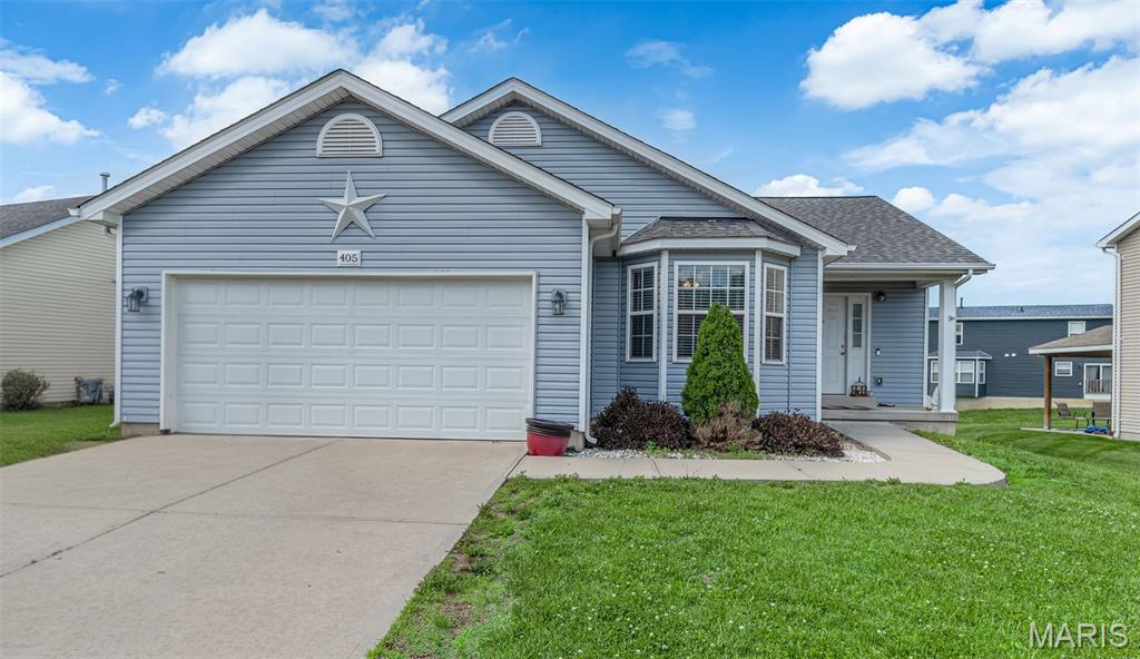 405 Stonewater Dr, Pevely, MO 63070 - ranch-style house featuring concrete driveway, a garage, a front lawn, and a shingled roof