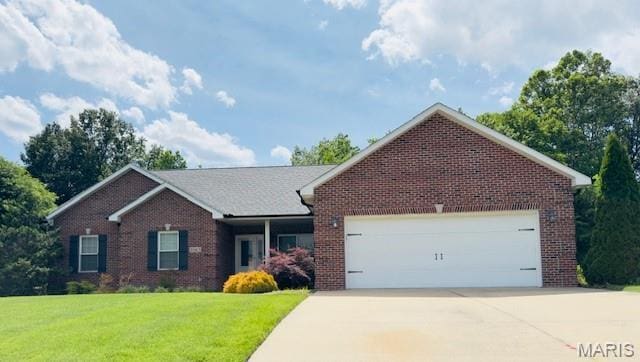 2063 Chesapeake Ave, Cape Girardeau, MO 63701 - ranch-style house with brick siding, a garage, a front lawn, and concrete driveway